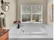The bathroom features a soaking tub and a large window offering outdoor views at 848 Huntington Pl, Highlands Ranch, CO 80126