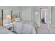Inviting bedroom with twin beds and a closet with sliding doors at 848 Huntington Pl, Highlands Ranch, CO 80126