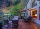Spacious wooden deck with patio furniture, ideal for outdoor dining and enjoying the beautiful sunset views at 848 Huntington Pl, Highlands Ranch, CO 80126
