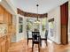 Cozy dining area with large windows, hardwood floors, and natural light at 848 Huntington Pl, Highlands Ranch, CO 80126