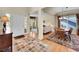 Bright entryway featuring hardwood floors, open floor plan, and dining area at 848 Huntington Pl, Highlands Ranch, CO 80126
