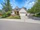 Beautiful home with a three-car garage, manicured lawn, and lush landscaping, perfect for Gathering living at 848 Huntington Pl, Highlands Ranch, CO 80126
