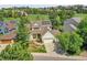 Charming two-story home with a well-manicured lawn, and solar panels at 848 Huntington Pl, Highlands Ranch, CO 80126