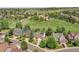 A neighborhood view showcasing the home's setting within a community surrounded by lush green spaces at 848 Huntington Pl, Highlands Ranch, CO 80126