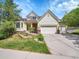 Charming home with a well-maintained lawn, flower beds, and a two-car garage at 848 Huntington Pl, Highlands Ranch, CO 80126