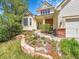 Inviting home exterior with manicured landscaping and a welcoming front porch at 848 Huntington Pl, Highlands Ranch, CO 80126