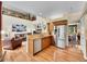 Open concept kitchen with stainless steel appliances and view to the living room at 848 Huntington Pl, Highlands Ranch, CO 80126