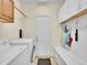 The laundry room features a washer, dryer, storage cabinets, and a utility sink at 848 Huntington Pl, Highlands Ranch, CO 80126