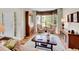 Cozy living room with bay window, hardwood floors, and elegant furnishings at 848 Huntington Pl, Highlands Ranch, CO 80126