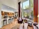 Spacious living room with vaulted ceilings, large windows, and open floor plan at 848 Huntington Pl, Highlands Ranch, CO 80126