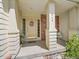 Welcoming front porch with decorative wreath and seating area at 848 Huntington Pl, Highlands Ranch, CO 80126
