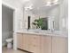 Modern bathroom featuring double vanity sinks, a large mirror, and contemporary fixtures at 4917 Lowell Blvd # 105, Denver, CO 80221