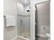Modern shower with glass door and tiled walls, located in a bright and stylish bathroom at 4917 Lowell Blvd # 105, Denver, CO 80221