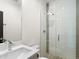Sleek bathroom featuring a glass-enclosed shower, modern fixtures, and a large vanity at 4917 Lowell Blvd # 105, Denver, CO 80221