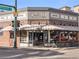 Exterior view of Parisi Pizzeria, showcasing its dining area and striped awning at 4917 Lowell Blvd # 105, Denver, CO 80221