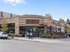 Exterior view of restaurant A.O.C. with outdoor seating and pedestrian activity at 4917 Lowell Blvd # 105, Denver, CO 80221