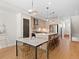 Bright open kitchen flows into the dining area, featuring an island with barstool seating at 4917 Lowell Blvd # 105, Denver, CO 80221