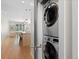 Convenient in-unit laundry closet with stacked washer and dryer at 4917 Lowell Blvd # 105, Denver, CO 80221