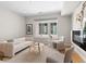 Cozy living room with a modern fireplace, comfortable seating, and bright natural light at 4917 Lowell Blvd # 105, Denver, CO 80221