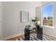 Well-lit office with stylish desk, modern art, and a large window offering ample natural light at 4917 Lowell Blvd # 105, Denver, CO 80221