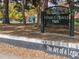 Sign for César E. Chávez Park with leafy groundcover in the foreground at 4917 Lowell Blvd # 105, Denver, CO 80221