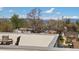 Scenic rooftop view highlighting city skyline and neighborhood, framed by deck seating area at 4917 Lowell Blvd # 105, Denver, CO 80221