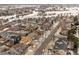 Aerial view of neighborhood featuring tree-lined streets and single-Gathering homes near an open field at 6583 W Gould Dr, Littleton, CO 80123