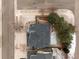 Aerial view of home featuring a dark roof, backyard deck, and surrounding landscape and street at 6583 W Gould Dr, Littleton, CO 80123