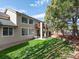 Expansive backyard features a private second-story deck, spacious lawn, mature trees, and ample space for recreation at 6583 W Gould Dr, Littleton, CO 80123