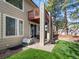 Private backyard features a second-story deck, lower-level patio, and lush lawn, perfect for outdoor entertaining at 6583 W Gould Dr, Littleton, CO 80123