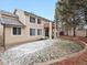 Two-story home featuring a backyard and deck for outdoor living, with snowy grass and tree views at 6583 W Gould Dr, Littleton, CO 80123