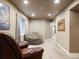 Relaxing basement area with a large beanbag chair, soft carpet, and a window at 6583 W Gould Dr, Littleton, CO 80123