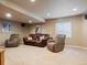 Finished basement with comfortable seating and carpeted floors at 6583 W Gould Dr, Littleton, CO 80123