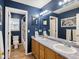 Beautifully designed bathroom with double sinks and elegant vanity mirror at 6583 W Gould Dr, Littleton, CO 80123