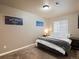 Cozy bedroom with neutral color scheme, carpeted floors, and natural light at 6583 W Gould Dr, Littleton, CO 80123