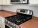 A kitchen showcasing stainless steel appliances and beautifully updated countertops at 6583 W Gould Dr, Littleton, CO 80123