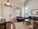 Inviting living room with a vaulted ceiling and oversized windows at 6583 W Gould Dr, Littleton, CO 80123