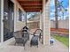 Covered patio area with outdoor seating, barbecue grill, and ample space for entertaining at 6583 W Gould Dr, Littleton, CO 80123