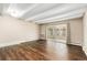 Spacious bedroom with wood floors, neutral walls, and sliding glass doors at 655 S Clinton St # 2A, Denver, CO 80247