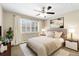 Cozy bedroom featuring a comfortable bed, ample natural light, and stylish decor at 655 S Clinton St # 2A, Denver, CO 80247