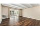 Bedroom featuring wood floors, neutral walls, and sliding glass doors to the outside at 655 S Clinton St # 2A, Denver, CO 80247