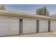 Exterior shot showing multiple garages at 655 S Clinton St # 2A, Denver, CO 80247