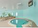 An indoor community hot tub room is shown with a circular hot tub at 655 S Clinton St # 2A, Denver, CO 80247