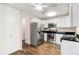 Well-equipped kitchen with stainless steel appliances and white cabinets at 655 S Clinton St # 2A, Denver, CO 80247