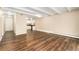 Open-concept room with hardwood floors, great natural light and kitchen access at 655 S Clinton St # 2A, Denver, CO 80247