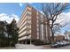 Brick apartment building with balconies and ample parking at 1085 N Lafayette St # 604, Denver, CO 80218