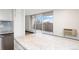 Modern kitchen with granite countertops and city views at 1085 N Lafayette St # 604, Denver, CO 80218