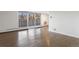 Spacious living room with hardwood floors and balcony access at 1085 N Lafayette St # 604, Denver, CO 80218