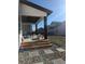Covered patio and backyard with fire pit, hardscape, and tasteful landscaping, perfect for outdoor enjoyment at 6332 E 142Nd Pl, Thornton, CO 80602