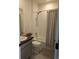 Compact bathroom features shower-tub combo, neutral tile, and modern vanity at 6332 E 142Nd Pl, Thornton, CO 80602